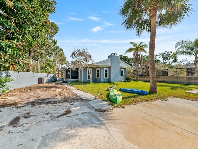 6726 Udell Ln, Hudson, FL 34667 - view of front of property with a chimney and stucco siding