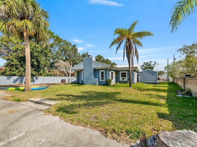 6726 Udell Ln, Hudson, FL 34667 - mid-century inspired home featuring a chimney and stucco siding