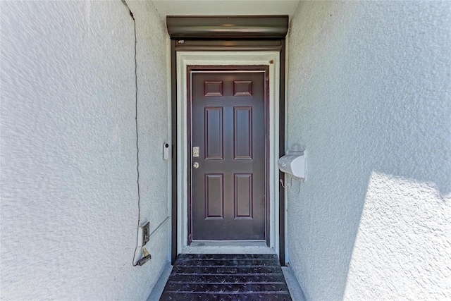 10732 Chippewa Dr, Parrish, FL 34219 - property entrance featuring stucco siding