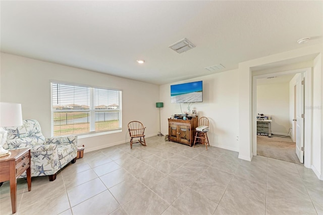 10732 Chippewa Dr, Parrish, FL 34219 - living area featuring light tile patterned floors and baseboards