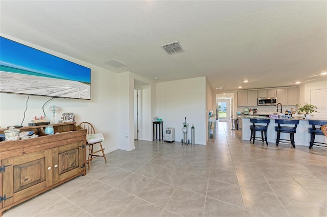 10732 Chippewa Dr, Parrish, FL 34219 - living area with light tile patterned flooring, recessed lighting, and a textured ceiling