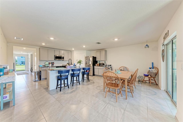 10732 Chippewa Dr, Parrish, FL 34219 - dining room featuring recessed lighting and light tile patterned floors