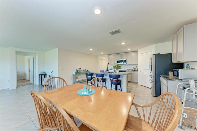 10732 Chippewa Dr, Parrish, FL 34219 - dining room featuring light tile patterned flooring and recessed lighting