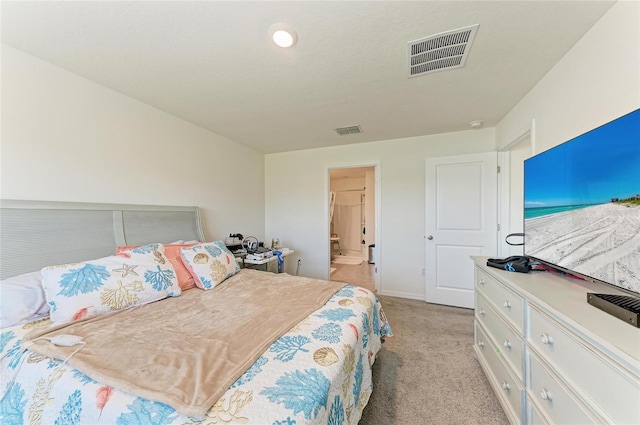 10732 Chippewa Dr, Parrish, FL 34219 - bedroom featuring light carpet, baseboards, and ensuite bath
