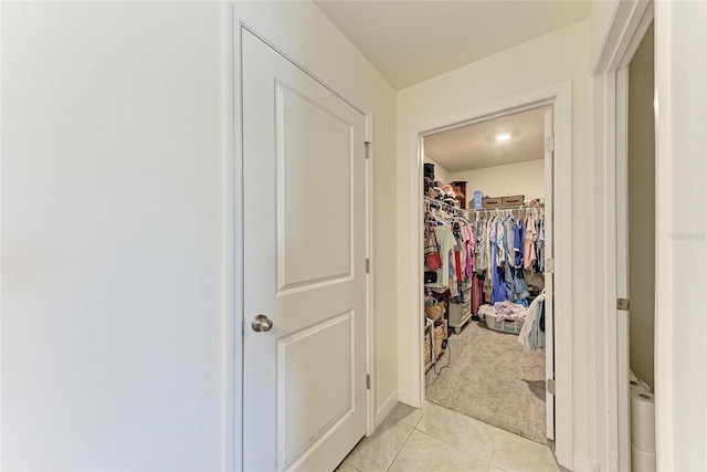 10732 Chippewa Dr, Parrish, FL 34219 - hall with light tile patterned floors and light carpet