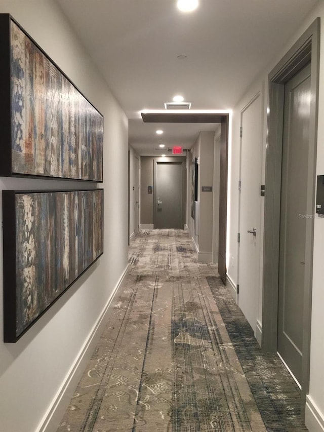 corridor featuring baseboards