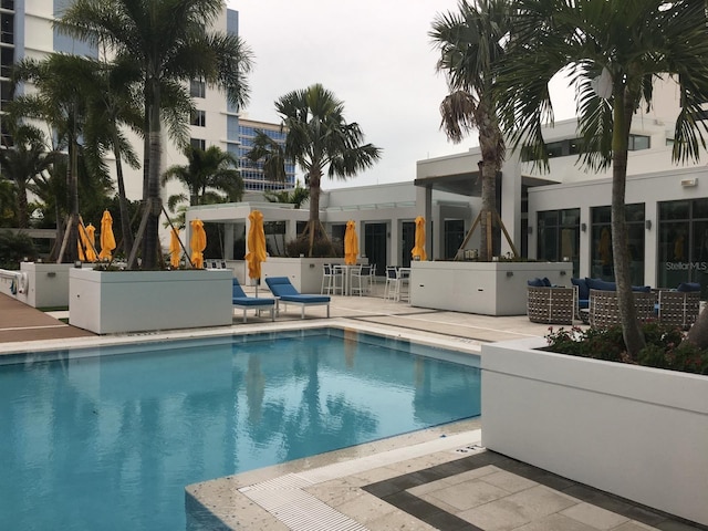 community pool with a patio area