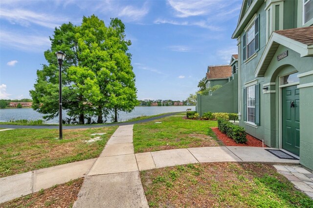 9602 Lake Chase Island Way Unit 9602, Tampa, FL 33626 - view of green lawn with a water view