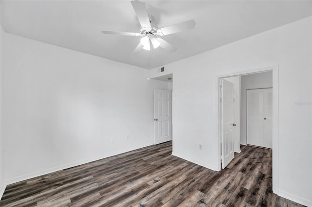 9602 Lake Chase Island Way Unit 9602, Tampa, FL 33626 - unfurnished room with dark wood-style floors, ceiling fan, and baseboards