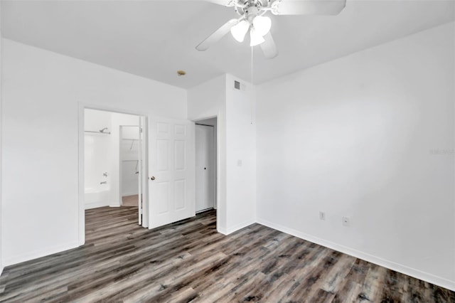 9602 Lake Chase Island Way Unit 9602, Tampa, FL 33626 - unfurnished bedroom featuring wood finished floors, baseboards, and ceiling fan
