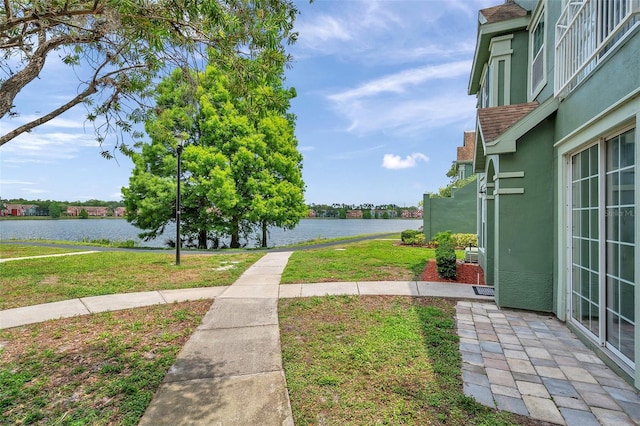9602 Lake Chase Island Way Unit 9602, Tampa, FL 33626 - view of grassy yard featuring a water view