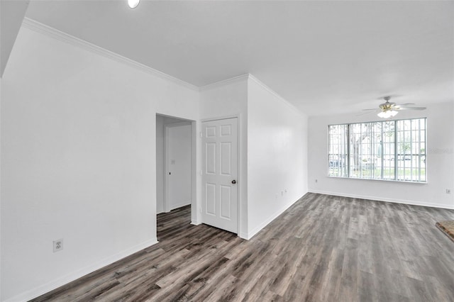 9602 Lake Chase Island Way Unit 9602, Tampa, FL 33626 - empty room featuring dark wood finished floors, ornamental molding, a ceiling fan, and baseboards
