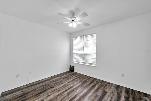 9602 Lake Chase Island Way Unit 9602, Tampa, FL 33626 - spare room featuring dark wood-style flooring, ceiling fan, and baseboards