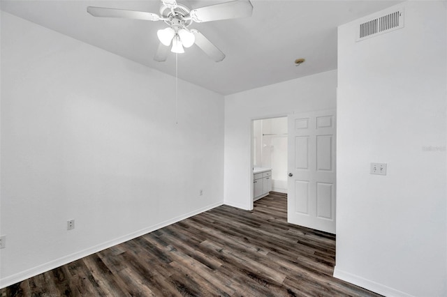 9602 Lake Chase Island Way Unit 9602, Tampa, FL 33626 - unfurnished room with dark wood-style floors, ceiling fan, and baseboards