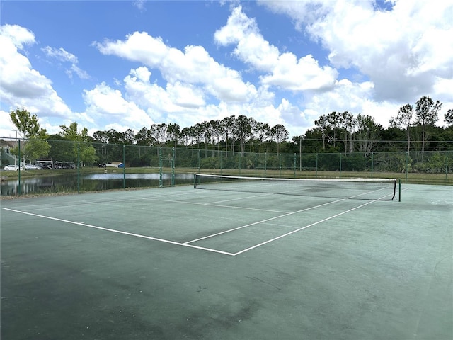 9602 Lake Chase Island Way Unit 9602, Tampa, FL 33626 - view of tennis court with a water view