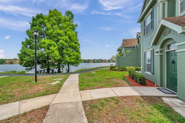9602 Lake Chase Island Way Unit 9602, Tampa, FL 33626 - view of grassy yard featuring a water view