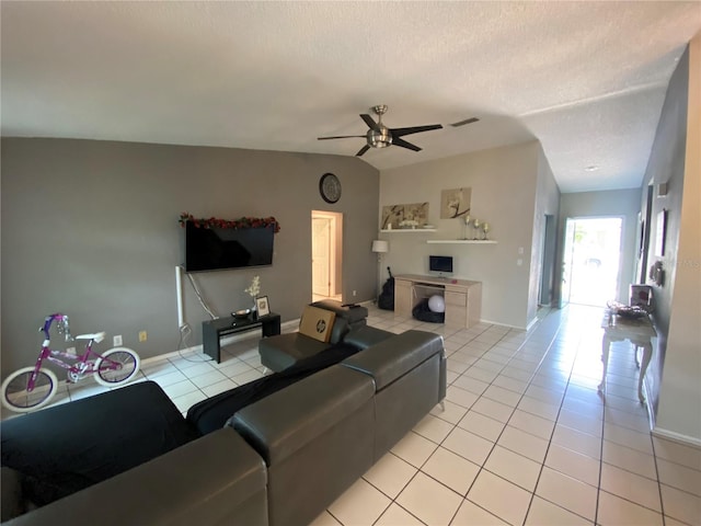 12912 Leadwood Dr, Riverview, FL 33579 - living area with light tile patterned flooring, ceiling fan, a textured ceiling, and baseboards