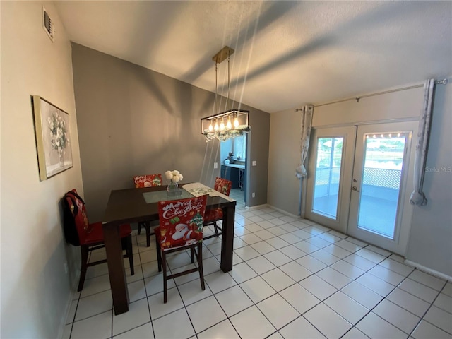 12912 Leadwood Dr, Riverview, FL 33579 - dining space featuring french doors, baseboards, a chandelier, and light tile patterned floors