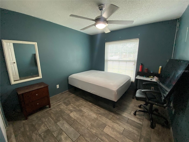12912 Leadwood Dr, Riverview, FL 33579 - bedroom with a textured ceiling, wood finished floors, an office area, and a ceiling fan