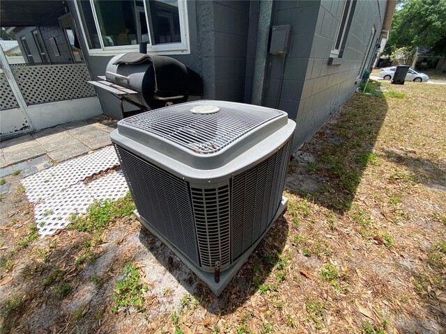 12912 Leadwood Dr, Riverview, FL 33579 - exterior view of central AC and concrete block siding