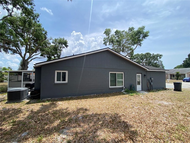 12912 Leadwood Dr, Riverview, FL 33579 - back of property with central AC and concrete block siding