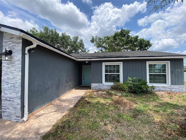 12912 Leadwood Dr, Riverview, FL 33579 - doorway to property with stone siding