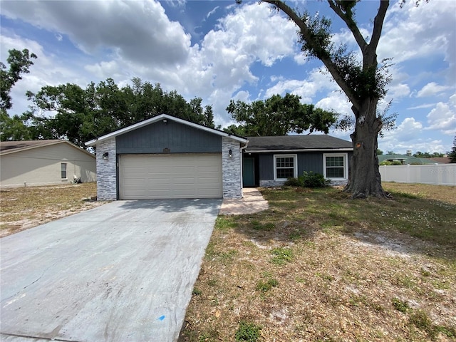 12912 Leadwood Dr, Riverview, FL 33579 - single story home featuring a garage, fence, driveway, and stone siding