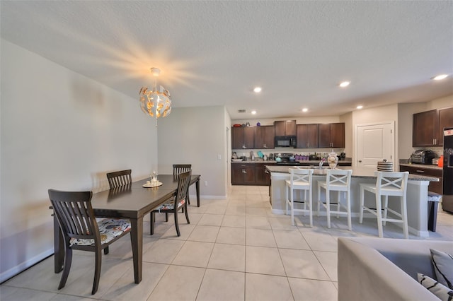 10210 White Linen Ave, Riverview, FL 33578 - dining room with a chandelier, recessed lighting, baseboards, light tile patterned floors, and a textured ceiling