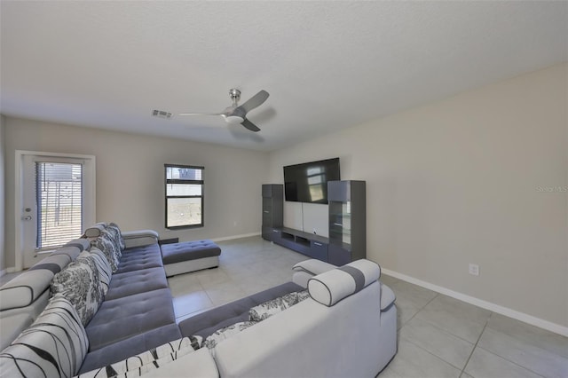 10210 White Linen Ave, Riverview, FL 33578 - living area featuring light tile patterned floors, ceiling fan, and baseboards