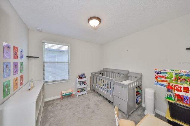 10210 White Linen Ave, Riverview, FL 33578 - carpeted bedroom featuring baseboards, a crib, and a textured ceiling