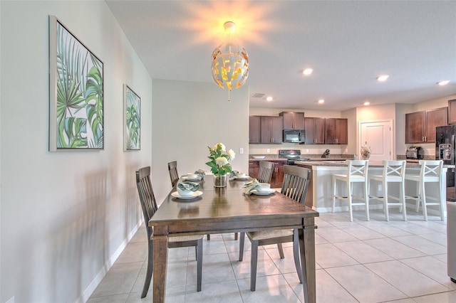 10210 White Linen Ave, Riverview, FL 33578 - dining area with a chandelier, recessed lighting, and light tile patterned floors