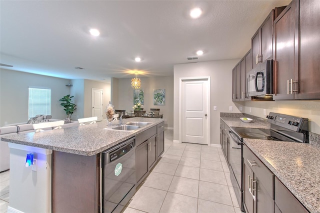 10210 White Linen Ave, Riverview, FL 33578 - kitchen featuring black appliances, a kitchen island with sink, open floor plan, light tile patterned floors, and dark brown cabinets