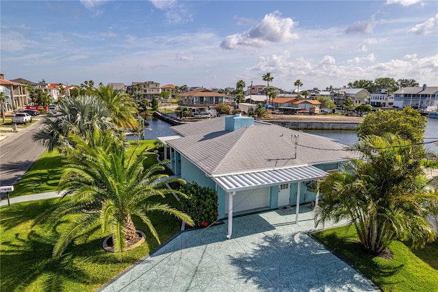 aerial perspective of suburban area featuring a large body of water