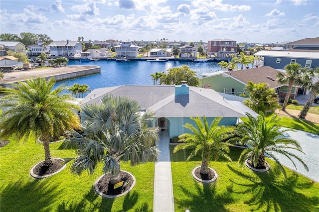 aerial perspective of suburban area featuring a nearby body of water