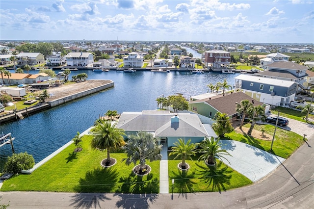 aerial view of residential area with a large body of water