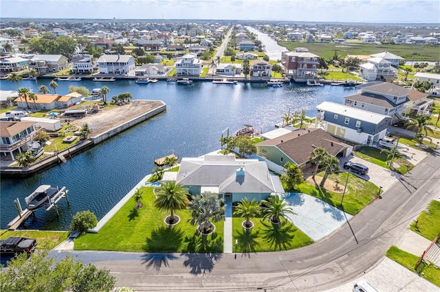 aerial view of residential area with a large body of water