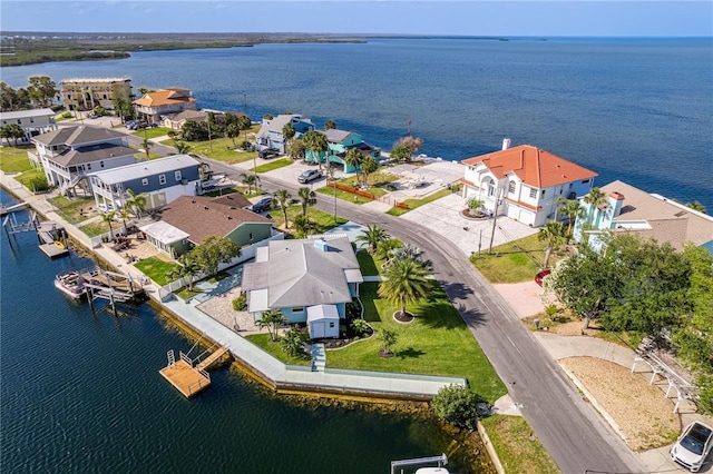 aerial perspective of suburban area featuring a large body of water