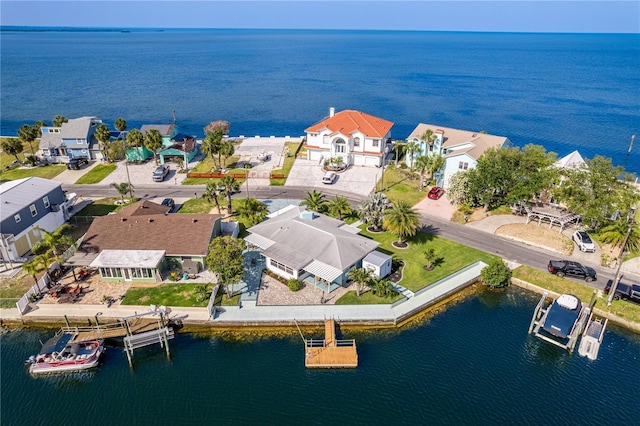 aerial view of residential area with a nearby body of water
