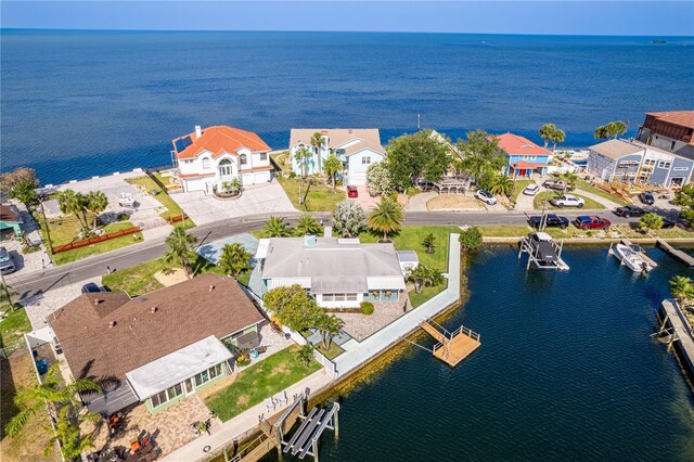 aerial view of residential area with a nearby body of water