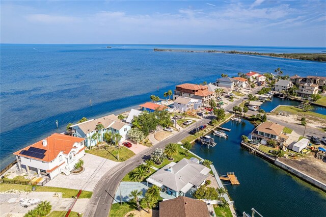 aerial perspective of suburban area with a nearby body of water