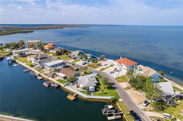 aerial view of residential area with a large body of water