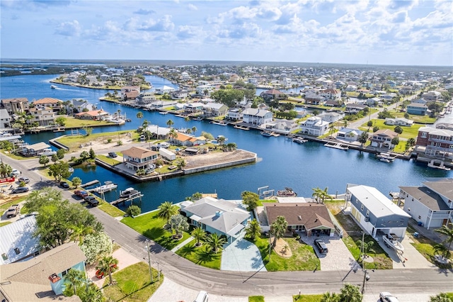 aerial view of residential area with a large body of water