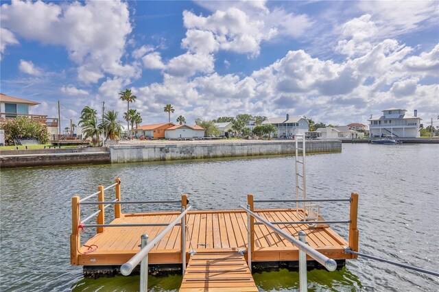 dock area with a water view and a residential view