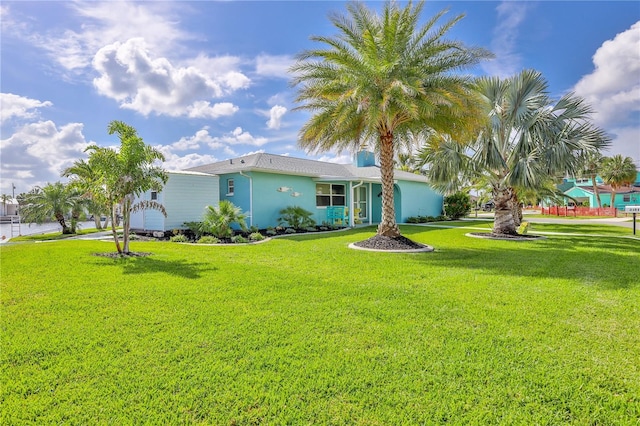 view of front of property featuring a front yard and stucco siding