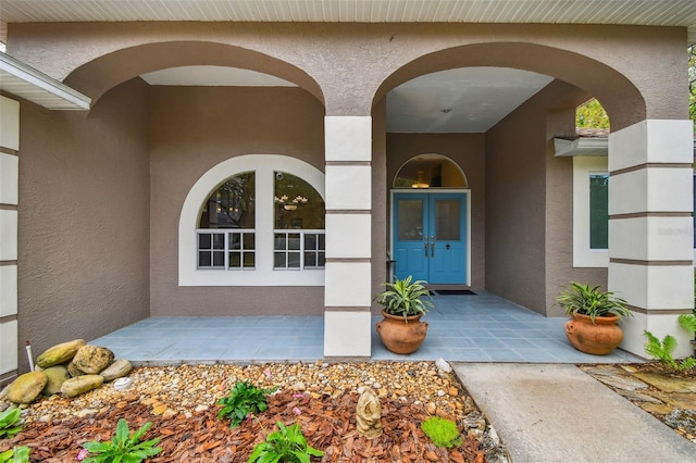 160 Sage Cir, Crystal Beach, FL 34681 - view of exterior entry with stucco siding