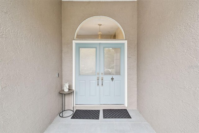 160 Sage Cir, Crystal Beach, FL 34681 - entrance to property with stucco siding and french doors