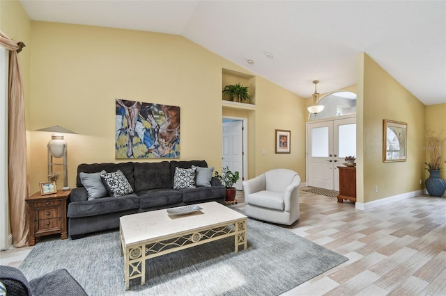 160 Sage Cir, Crystal Beach, FL 34681 - living area featuring light wood-style floors, baseboards, and high vaulted ceiling