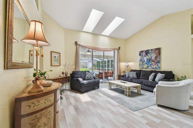 160 Sage Cir, Crystal Beach, FL 34681 - living room with light wood-style floors, a skylight, and high vaulted ceiling