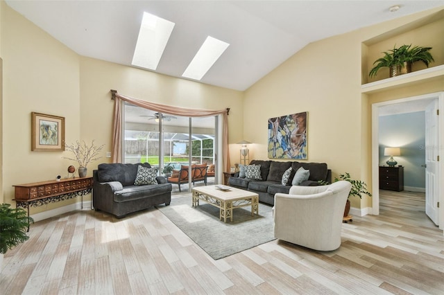 160 Sage Cir, Crystal Beach, FL 34681 - living room with a skylight, light wood-style flooring, and high vaulted ceiling