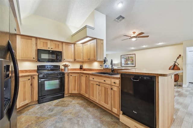 160 Sage Cir, Crystal Beach, FL 34681 - kitchen with black appliances, a peninsula, a sink, ceiling fan, and light brown cabinetry